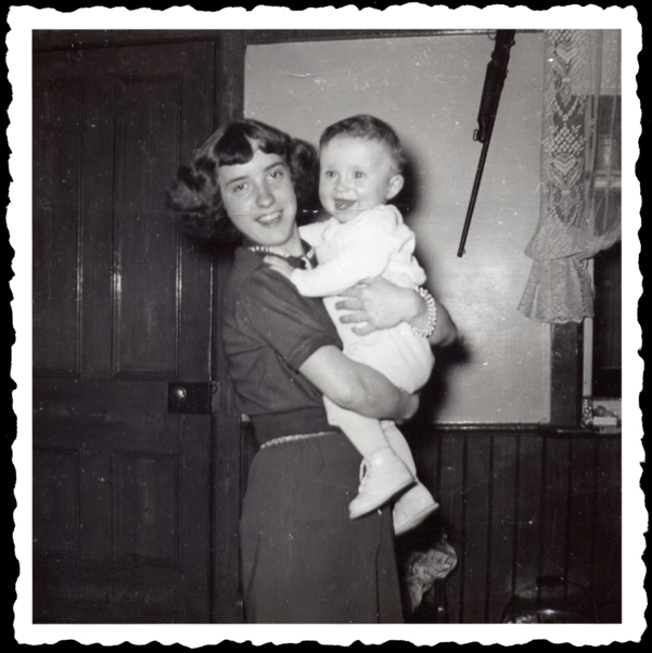 Aunty proudly displays her nephew in a 1950's worn out snapshot.