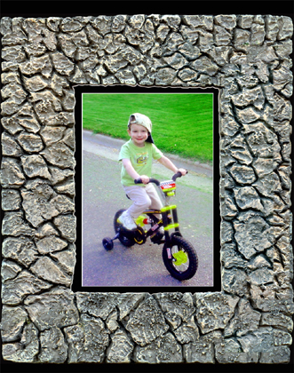 Digital Rock Frames a boy on his bike.