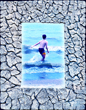 Digital Rock Frames a child running into the surf.
