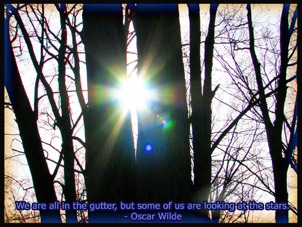 A sun flare through a twilit trees is captioned: 
	“We are all in the gutter but some of us are looking at the stars.” — Oscar Wilde